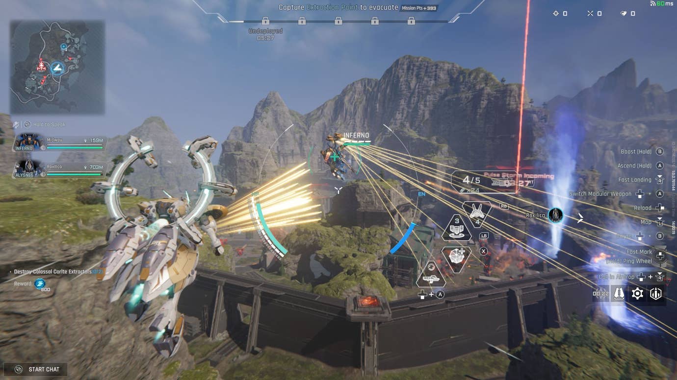 A white healer mech flies above a green rocky landscape, firing bullets accidentally at their own team mate.